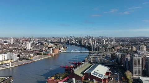 Static aerial view of River Thames with aircraft and boat near London Stock Footage 323680393