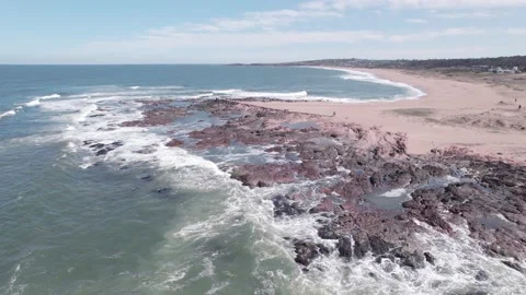 Static aerial view rock cliff and beach Stock Footage 220688568