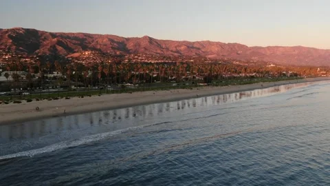Static aerial view of Santa Barbara coastline and mountains at sunset Stock Footage 211201033