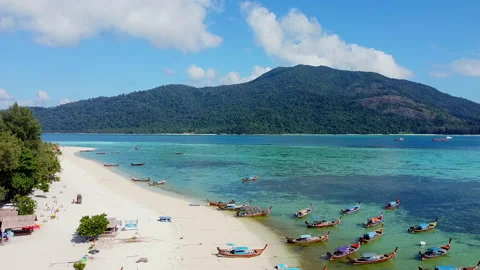 Static Aerial View of Topical Beach with White Sand, Blue Sea, Wooden Boats Stock Footage 153327377