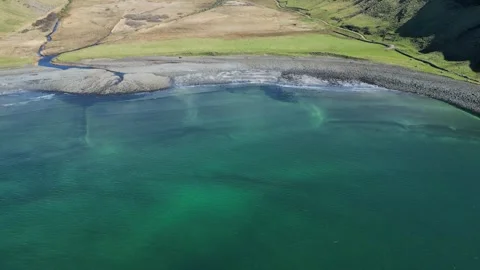 Static aerial view of waves hitting the beach in Scotland 動画素材 334457795