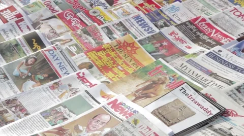 Static Asian Newspapers on Table (Yangon, Burma) Stock Footage 56632450