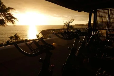 Static bicycles with views at the sunset Stock Photos