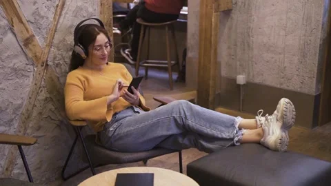 Static camera movement of a relaxed young woman listening to music Stock Footage 221860242