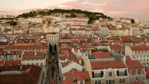 Static clip looking across the rooftops of central Lisbon at sunset. Stock Footage 119764102