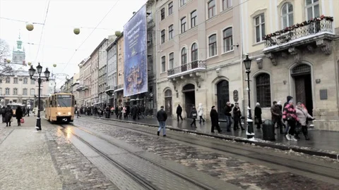 Static clip of old tram passing Rynok Square in Lviv, Ukraine Stock Footage 101008659