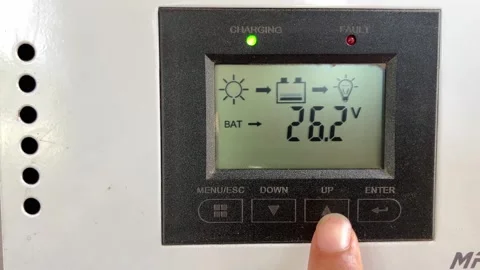 Static Close Up Of Finger Pressing Button On MPPT Solar Charge Controller Stock Footage 337403168
