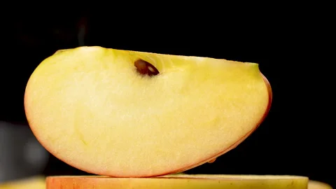 Static Close Up Fresh Apple Wedge With Seed On Black Background 4K Stock Footage 321867434