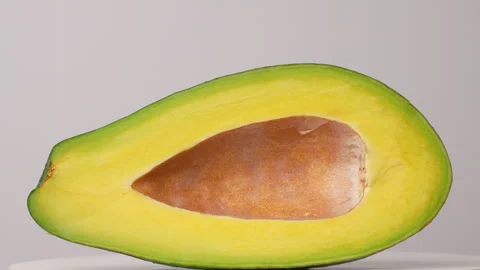 Static Close Up Fresh Avocado Half Pitted Without Seed White Background 4K Stock Footage 322088287