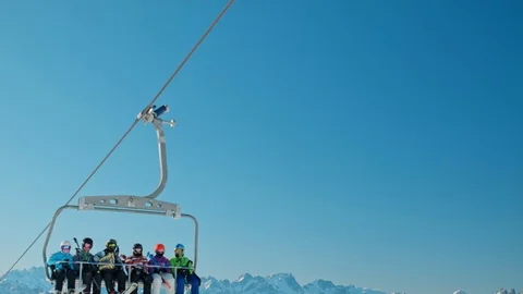 Static close up people in ski lift waiting to ski in the alps under the blue sky Stock Footage 71126583