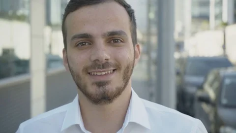 Static close up shot of friendly Caucasian young man listening Stock Footage 97923015