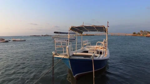 A static, close-up shot of a small boat on the water Stock Footage 314500613