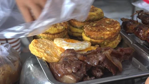 Static Close Up Vendor Hands Plastic Bag Eggs Omelette Siem Reap 4K Stock Footage 348620258