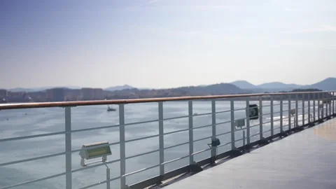 Static coastal view from a ship deck with white railings 库存影片 346971361