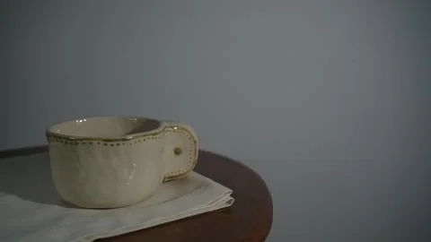 Static coffee cup on table in minimalist workspace Video stock 327350092