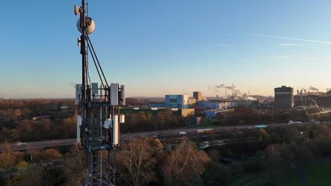 Static dawn shot of telecom tower by motorway Stock Footage 340938937