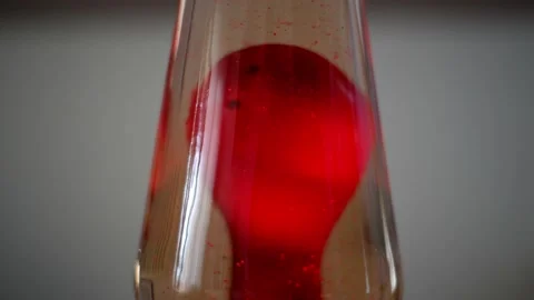 Static detail shot of tiny red bubbles floating inside a vintage lava lamp Stock Footage 208263893