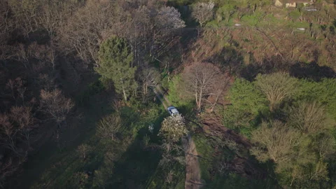 Static Drone Overhead Pickup Passing Through Woodland Stock Footage 336563178