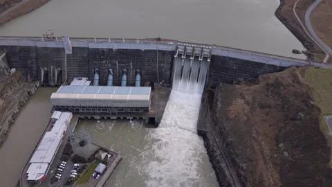 Static Drone Records Clyde Dam, Four Open Spill Gates and Hydroelectric Power Stock Footage 345665826