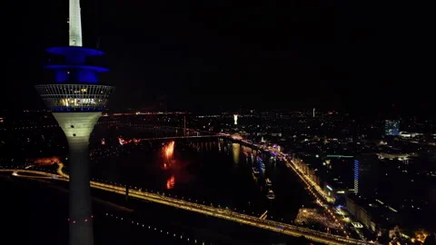 Static drone shot with fireworks and evening lights of the Old Town Düsseldorf 스톡 동영상 220340102