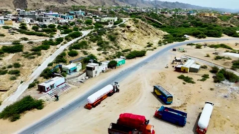 Static drone shot of the ocean with calm waves reaching the shore of a white Stock Footage 284444380