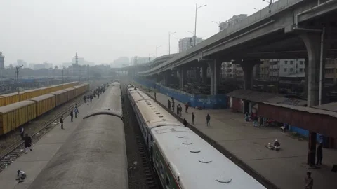 Static Drone Shot Over Trains with Person Sitting on Roof at Station in Dhaka Video stock 327363480