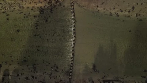 Static drone shot of stepping stones over the River Lerryn in Cornwall Stock Footage 327986914