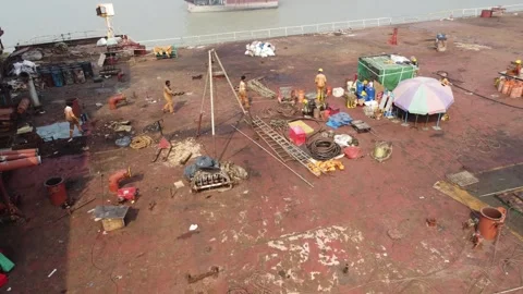 Static Drone Shot of Workers on a Ship Deck at a Shipbreaking Yard Stock Footage 327195732