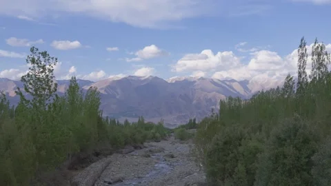 Static Drone Timelapse of Ladakh Mountains with Moving Clouds and Scenic Stock Footage 334421231