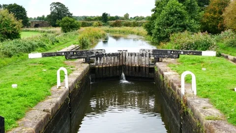 Static establishing shot of Moss Lock (4) on a canal in the north west of the UK Stock Footage 163092457