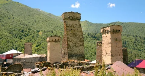 Static exterior shot of Stone medieval fortified Svaneti tower houses of Murkmel Stock Footage 104384783