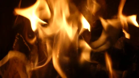 Static extreme close up of bright fire flames burning in dark Stock Footage 342131186