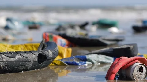 Static extreme close up of plastic garbage and trash on beach. Changing focus Stock Footage 51025929