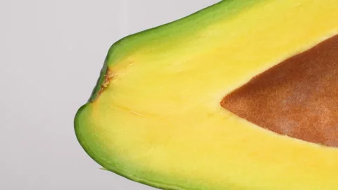 Static Extreme Macro Of Avocado Cross Section With Seed White Background 4K Stock Footage 322086395