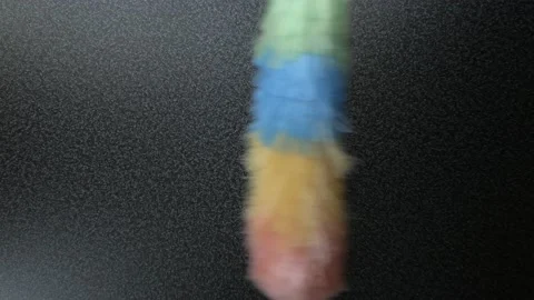 Static feather duster moving over table Stock Footage 121687226