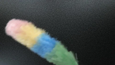 Static feather duster moving over table Stock Footage 121687243