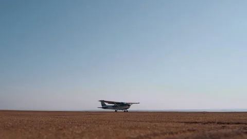 The static ground-level frame of a helicopter that is set in motion on the Stock Footage 155627449