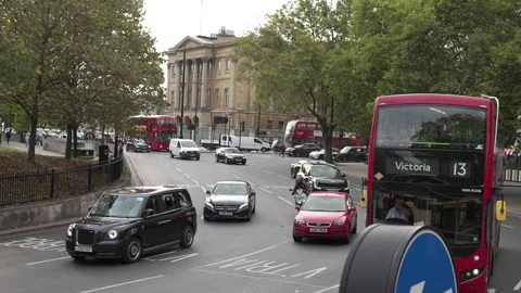 A static handheld slow-motion shot captures the bustling traffic navigating a Stock Footage 300857485