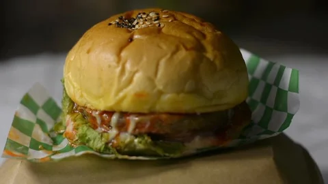 Static Hero Shot of Classic Beef Cheeseburger on Dark Background Stock Footage 342743504