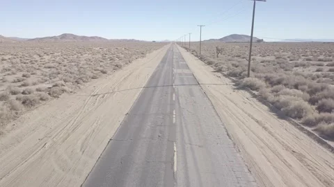Static high shot of black jeep on road in Californian desert Stock Footage 171486882
