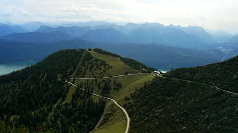 Static of hiker path on mountain peak and beautiful Walchensee in background. Video stock 139607486