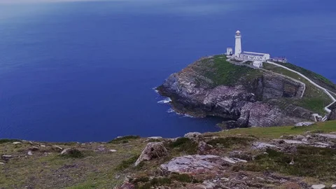 Static - Lighthouse, blue sky, windy weather, bird sanctuary, crashing waves 2 Stock Footage 199062957