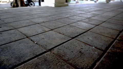 Static low angle shot of a clean paved stone tile floor walkway outdoors on.. Stock Footage 342027294