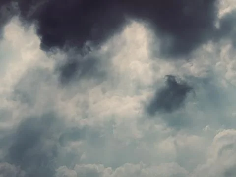 Static Low Angle Shot of Dramatic Dark Storm Clouds in Sky Stock Photos