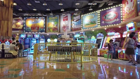 Static low angle shot of a section of an indoor arcade center. Some Video stock 227273333