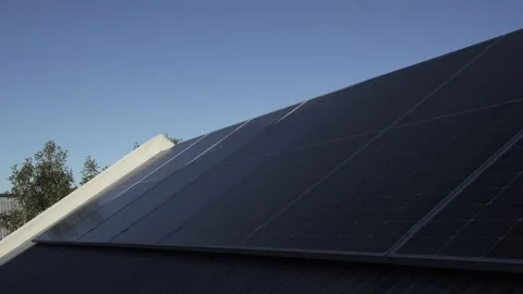 Static Low Angle Time Lapse of Shadow Moving Across Rooftop Solar Panels Video stock 336287893