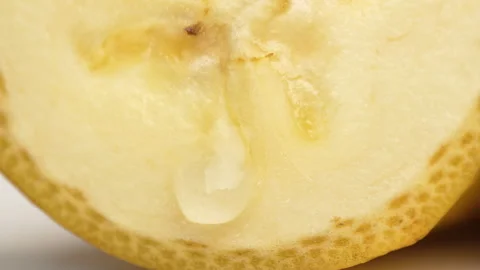 Static Macro Banana Slice With Falling Water Drop Freshness 4K Stock Footage 322142211
