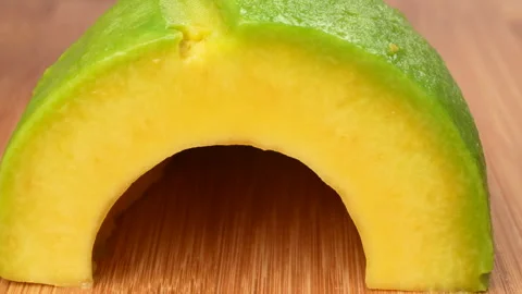 Static Macro Close Up Knife Slicing Fresh Green Avocado Texture 4K Stock Footage 322085148