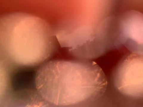 Static Macro Extreme Close-Up of Beads Creating Soft Warm Bokeh Background Stock Photos