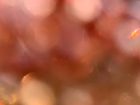Static Macro Extreme Close-Up of Beads Creating Soft Warm Bokeh Background Stock Photos